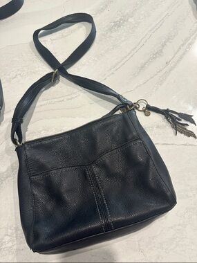 The Sak Black Pebbled Leather Shoulder Bag with Feather Charm